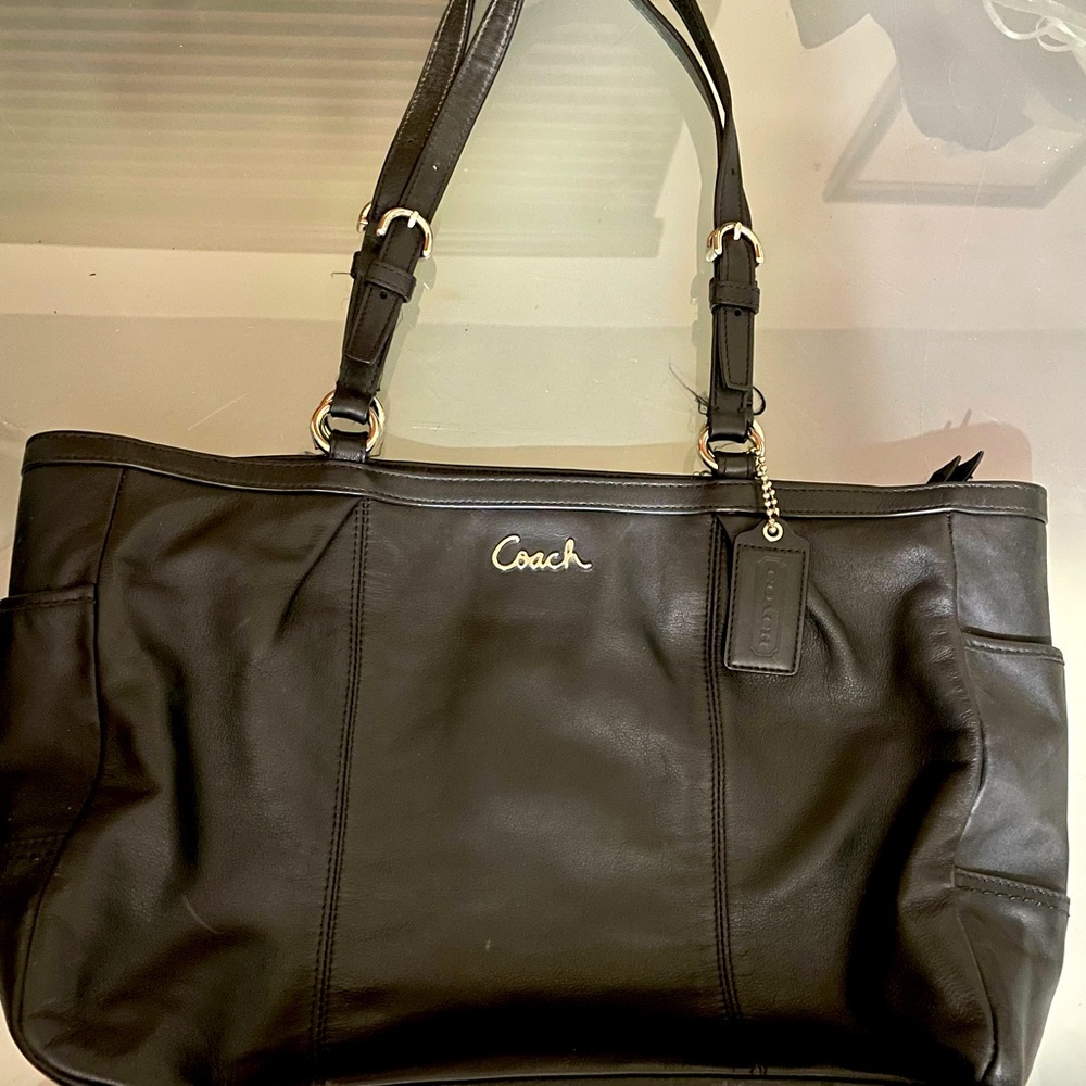 Genuine Coach black leather shoulder purse.